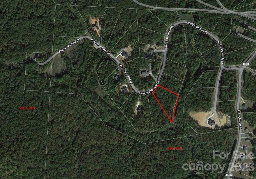 1.67 acre nice wooded lot in the beautiful, secluded, expansive Kings Pinnacle Subdivision with all custom built homes. If you come to visit this subdivision, most likely you will love it! It is is only 6 miles or 8 minutes to the new Catawba Two Kings Casino. It is one of the best lot in the subdivision. Do not let it go. Could be combined with lot 5147.