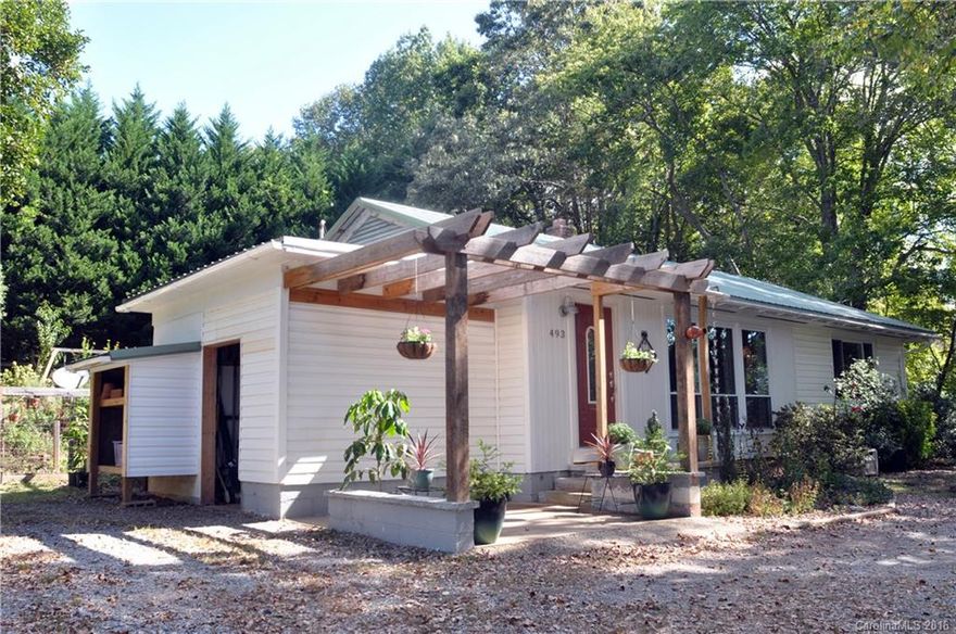 Quintessential 1950's cottage home. Beautiful original oak hardwoods throughout. Huge NEW custom size widows bring the out doors in. Full of light and charm. The kitchen is the epitome of a cottage home with the upgrades that make it work for any cook.  You will fall in love with the landscape, perfect cook out backyard, plenty of room for children to play, circular drive tops it off. Make this your summer home, vacation rental investment property or best of all, a perfect full time residence.