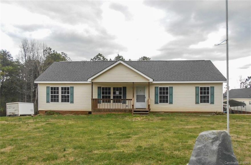 Less than 2 miles from downtown York. Bright, open floor plan. Large country kitchen with lots of cabinets and counter space. Split floor plan. master bedroom and bathroom are spacious. Master bath has two sinks.  There is a walk in closet in the master bedroom. Covered front porch and back deck.  Needs interior paint, carpet replacement and carpentry repairs. The front yard is large and level. Back yard gently sloping and backs up to a wooded area.