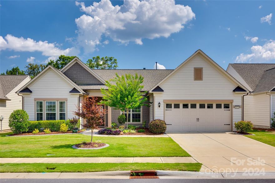 Welcome to this VERY desirable, single-story Dunwoody Way model, 3 BR/3 Bath + office, located in the award-winning 55+ community of Carolina Orchards in Fort Mill, SC. This immaculate home has been professionally updated since completion in 2019. Primary suite overlooks the private professionally designed patio & landscaping in a fenced backyard w/ 2 gates. Front entry and glass-enclosed patio w/ 2 sliders are stamped concrete. Whole house water filtration system, new Jacuzzi Brand tub and shower surround, 240amp garage heater and Epoxy floors make the garage a comfortable place to tinker with hobbies. Open floorplan. Patio lighting under stone seating.
With this 55+ community, residents have access to a range of amenities tailored to an active & social lifestyle. This includes a clubhouse, fitness center, indoor & outdoor swimming pool, tennis and pickleball courts, walking trails, & various social activities to enjoy with like-minded neighbors. Don't miss this beautiful home!