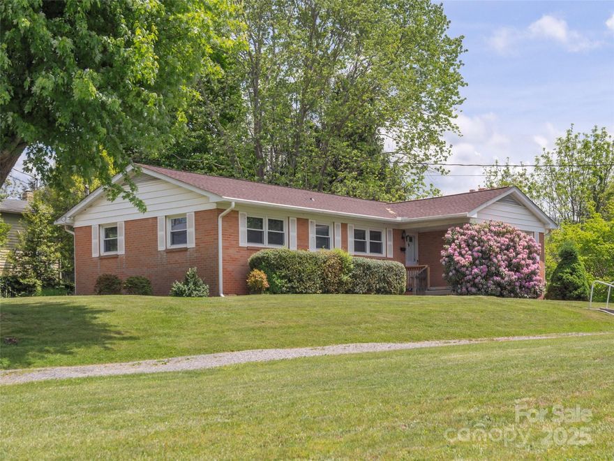 Charming brick ranch on a beautiful lot with a spacious driveway and just the right mix of shade trees and open sunshine perfect for a garden. The interior is filled with natural light, highlighting the hardwood floors in the living room and bedrooms. Great layout with a drive-under garage and an unfinished basement offering tons of storage or potential for additional living space. A shed provides even more storage outside. With a little TLC, this home is a perfect canvas for its next owner. ** Calling for highest and best offer by tomorrow (Friday, 5/16) at noon.