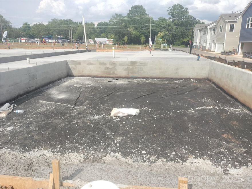 Experience modern city living in a beautifully-designed 2-story townhome featuring 2302 sq ft, 3BR, 2,5BA, Large Loft & 2-Car Garage. Located in a quaint 58 townhome community, we're just 3 miles from Uptown Charlotte and 10 minutes from Charlotte Douglas International Airport.

Our Adaline plan is perfect for entertaining! It features a spacious kitchen w/huge island, plenty of cabinets plus a large pantry. LVP flooring is throughout the main level. An oak tread staircase leads to the loft, 3 bedrooms, 2 baths, and laundry room. The Primary Suite boasts a large walk-in closet, a luxurious bathroom having a 5' tiled walk-in shower w/seat and separate vanities.

As part of Charlotte’s revitalization, Greenway Overlook is built on a site which was formerly industrial. As a result, it qualifies for significant tax rebates-- in fact thousands of dollars in property tax rebates over the next 5 years. 

***Added Bonus*** HOA dues include water, sewer, trash removal, and landscaping