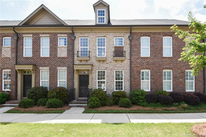 Beautiful full brick 2 bedroom 2.5 bath townhome in the sought after Charleston style community of Cedar Walk. Home features hardwood floor, kitchen with stainless appliances and open first floor plan. Second floor with two full baths. Fenced backyard and patio/walkway to one car garage. Conveniently located in a thriving mixed use community, walk to shopping and dining.  Just minutes from Uptown.
