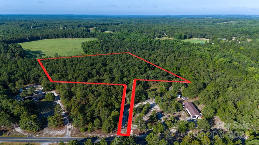 Nice, level 6 acre lot on Fletcher Dr. in Kershaw Co., NORTH CENTRAL SCHOOL DISTRICT.  PERK TEST already in place for SEPTIC, & Cassatt Water hook up is available.  A SURVEY is already in place as well.  This plot of land is ready to build on or move a mobile, modular in.  The property by a driveway that leads to the open space in the back....great for privacy!  Camden, Kershaw, Columbia & Charlotte is within an hours dr. from this property.  Better take advantage while it's here.  Call me or your Realtor of choice to MAKE IT HAPPEN!