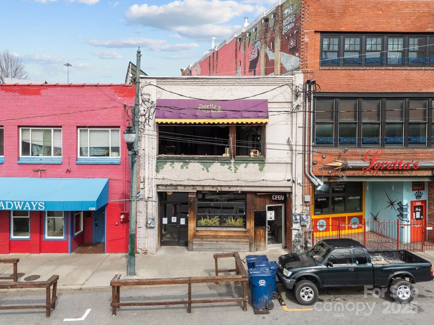 Welcome to a well-established location in Asheville's vibrant downtown district! Inside the building, bars and restaurant areas have a stylish layout complementing Asheville's local culture, steps away from nearby shops and live music venues.
The space comes with necessary fixtures and equipment for bar and restaurant operations, making it a turn-key option for new owners. There are 2 Parklets outside of the property on 116 N. Lexington Street that will allow for outdoor dining. There are two entrances to the building, one on Broadway Street and on N. Lexington Street. 116 N. Lexington is the primary access to the building for both downstairs and upstairs venues. Broadway Street entrance only accesses the upstairs Bar and Restaurant. The paid parking lot across the street on N. Lexington Street plus street parking on the block provide ample access to the building. There is a tenant with a lease until June 30th, 2028.