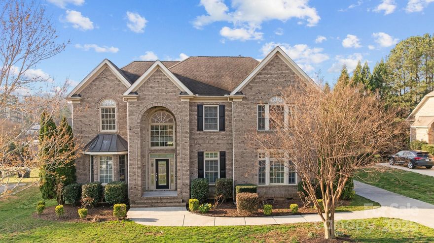 LISTING PRICE $10K LOWER THAN APPRAISAL DATED 9/14/25!!!  Stunning Full Brick Home in Quiet Winding Creek Neighborhood. Located in the peaceful Winding Creek neighborhood with a low HOA fee, this beautiful full brick home offers both luxury and convenience. Just a short distance from an elementary school, shopping center, and a variety of restaurants, this home is perfectly positioned for both family living and work life. Key Features: Open Floor Plan with an extended breakfast area, providing ample space for gatherings. Gourmet Kitchen with a gas burner on an island with downdraft exhaust, convection double oven, and microwave. Formal Living Room and spacious Dining Room with elegant tray ceiling. Two-Story Great Room, pre-wired for 5.1 audio system, perfect for entertainment. Hardwood Floors throughout the main level, adding sophistication and durability. Primary Bedroom with a large sitting area, whirlpool bathtub, and walk-in closet. Guest Room and Full Bath conveniently located on the main floor. 6 Bedrooms and 4 Full Bathrooms, providing plenty of space for everyone. Large Bonus Room ideal for additional leisure or office space. Huge Media Room above the garage, pre-wired for projector and 5.1 surround sound for ultimate home theater experience. Extended Concrete Patio in the back, perfect for outdoor dining or relaxation. Central Vacuum System for easy cleaning, with all dust collected in a central location in the garage. This spacious home offers everything you need for comfort, entertainment, and productivity, with a functional design and premium features