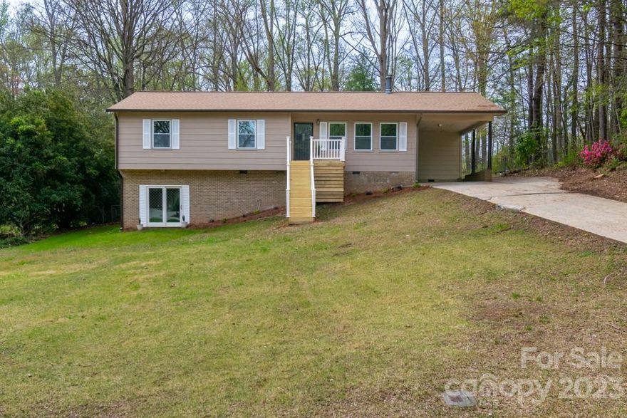 This home sits on a half acre, fenced in yard. It has many updated features, including appliances. The floors, water heater, kitchen and bathrooms have all been updated. There is a screen in porch on the backside of the house.