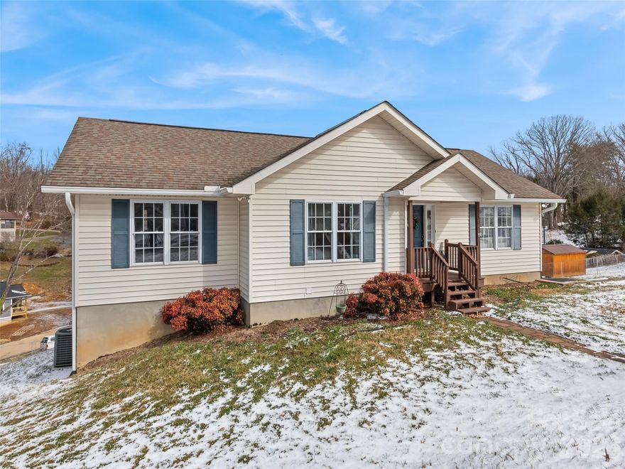 This charming 3-bedroom, 2-bathroom home offers convenient main-level living and is located less than one mile from downtown Canton with easy access to local shops, dining, and everyday amenities. The home features a newly remodeled en-suite primary bedroom, fresh interior paint, and a comfortable layout designed for everyday living. An unfinished basement provides excellent storage space or potential for future expansion. Outside, enjoy a large backyard with beautiful mountain views, perfect for gardening, raising chickens, or simply relaxing outdoors. Situated on unrestricted land, the property also includes a 2-car attached garage and is located on a publicly maintained road. Conveniently, the home is within walking distance of North Canton Elementary School, making it an ideal combination of peaceful living and close-to-town convenience.