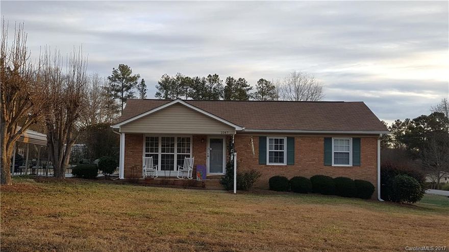 Wonderful home and move in ready. Beautiful hardwood floors in living room and bedrooms. Brick home with new vinyl windows, and vinyl siding for maintenance free on exterior. Large corner lot, with great detached garage/shop. Lots of storage.