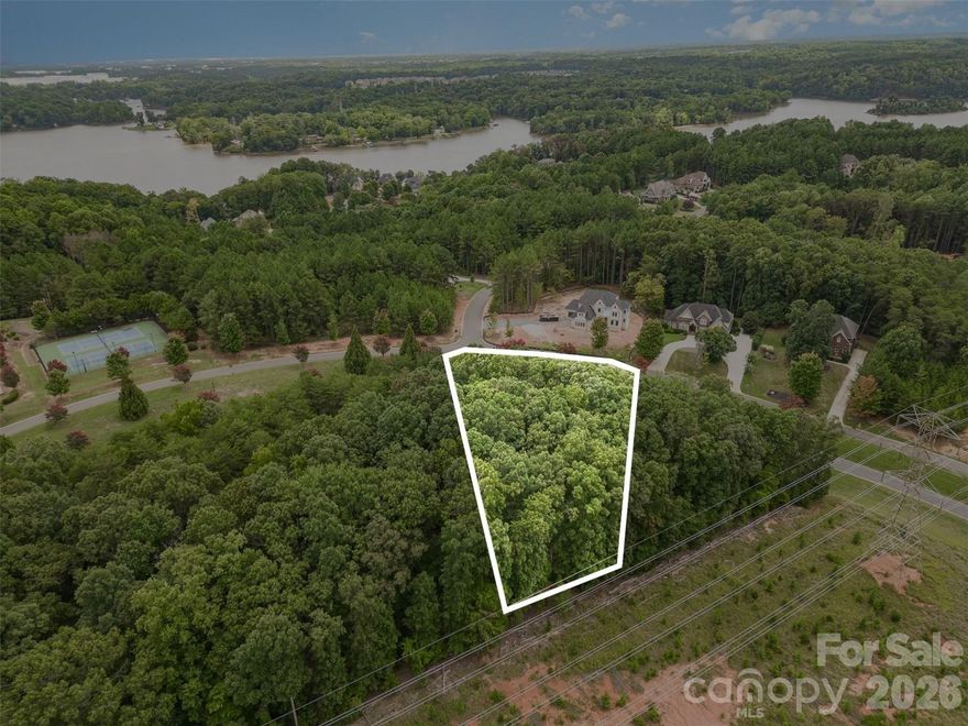 Seize the opportunity to craft your perfect home on this spacious lot located off the scenic Lake Wylie, within a secure gated community.  Enjoy a lifestyle of relaxation and recreation with amenities including a pristine pool, basketball and tennis courts, a public beach, and easy boat access. This is your chance to build your dream home in a private, recreational paradise. Make your dream a reality today! For more info, please visit, https://reflectionpointehoa.com/acc-information-policies/