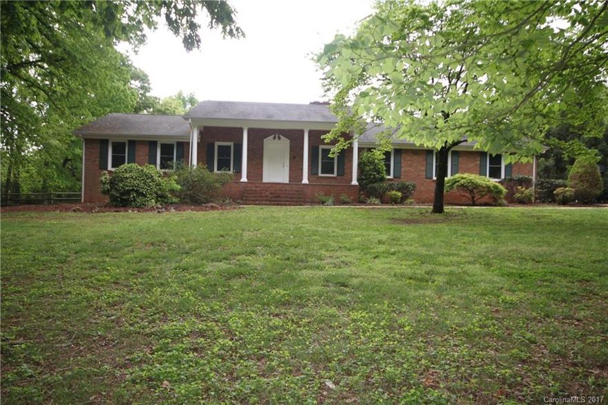 Privacy on this 2.25 acres with a beautiful front porch, formal living & dining room, new granite counters, new SS appliances, freshly painted, basement with a kitchenette, den & full bath, screened porch overlooks a private fenced backyard, 2 outbuilding, 1 for RV and 1 multi use and wired with 110 service.