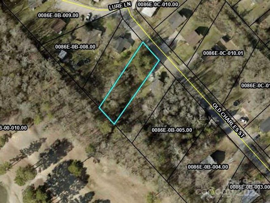 This property is located just minutes away from local shopping centers and other conveniences. It is a beautiful wooded lot, perfect to build a starter home or as an investment opportunity. ..Please inspect this property and validate it for any use that you intend it for prior to writing an offer. Lot has access to city water. Perc test needed.
