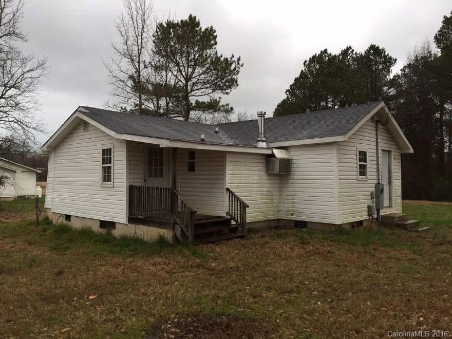 Cottage home in need of some love.  Good starter home or investment home with two bedrooms and one bath.  Convenient to all amenities near US HWY 74