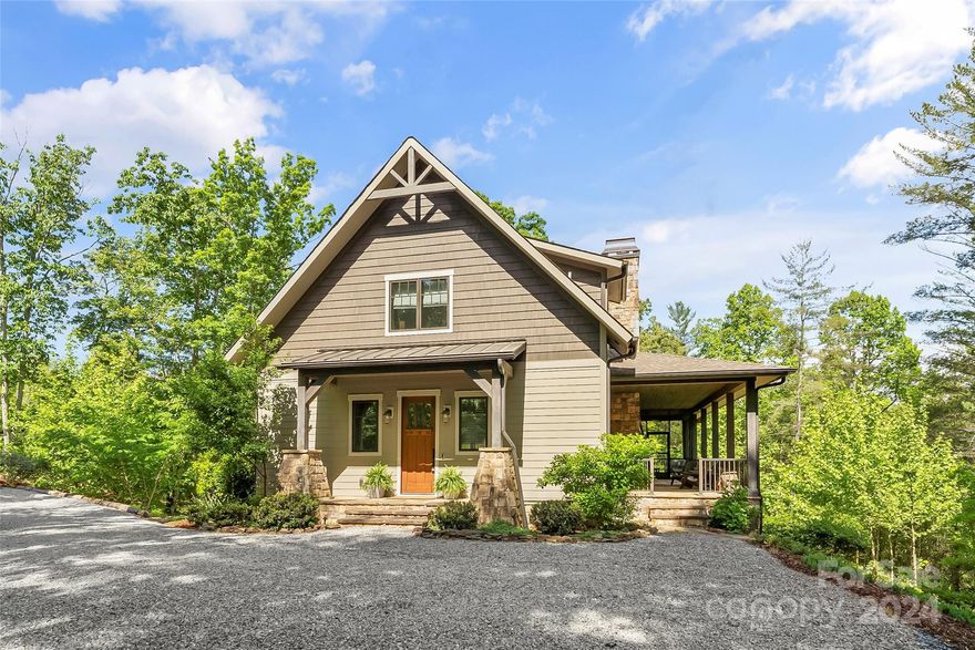 Live your lakehouse dream here!  Main level open floorplan made for entertaining with access from the living areas to grilling deck and screened/open porches with dining area, swing and fireplace.  Upper level has 2 bedrooms, full bath & large family room with trundle bed & nook for gathering.  Head to the finished lower level with billiard area, full bar, separate bedroom and bath & bunkroom to accommodate toddlers to teens. Unfinished basement workshop & lake toy storage area. Built in cabinetry throughout the home in the mudroom/laundry, kitchen, bunkroom & bedrooms. Don't miss the outside shower & bathroom area and lower patio. From there, take a leisurely walk down the path to the fire pit and a few steps to lakeside deck, covered dock w/lift, jetski port, all in composite decking for easy maintenance.   Quiet, deep water cove perfect for floating and enjoying the lake. Membership to Camp Lake James is included featuring pool, social hall, fitness facilities and pickleball courts.