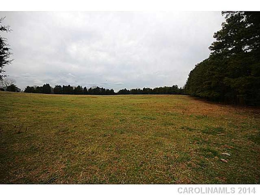 approximately 25 acres divided from a beautiful 130 acre farm that was handed down from generation to generation.  Your chance to own a piece of history. This tract is mostly open with pasture land and wooded on back.  Located only 6 miles from Lake Wylie shopping. No HOA. No HOA fees. Horses welcome.  Build when you want with who you want or choose one of our builders.  Great Clover Schools.