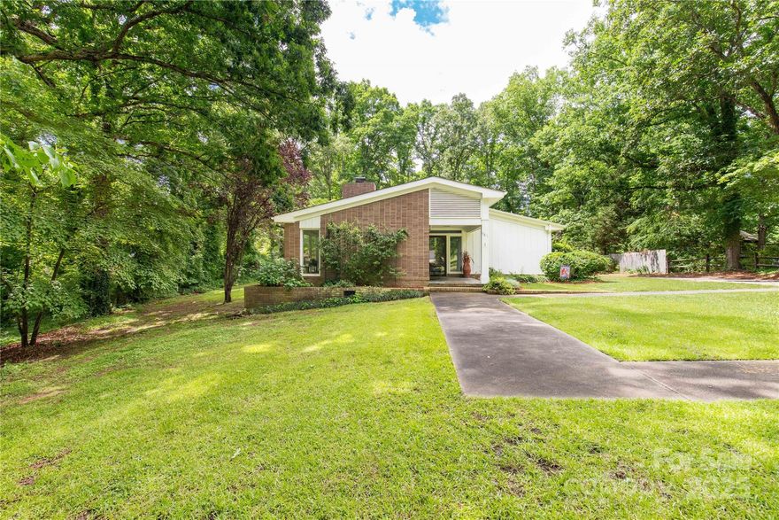 This fully renovated Forest Hills ranch combines modern comfort with timeless style. Large windows fill the home with natural light, highlighting the open layout and updated finishes throughout. A dedicated office offers the perfect work-from-home space. Nestled among mature trees, the property provides a peaceful, private setting on over an acre—ideal for relaxing or entertaining. Move-in ready and full of charm!