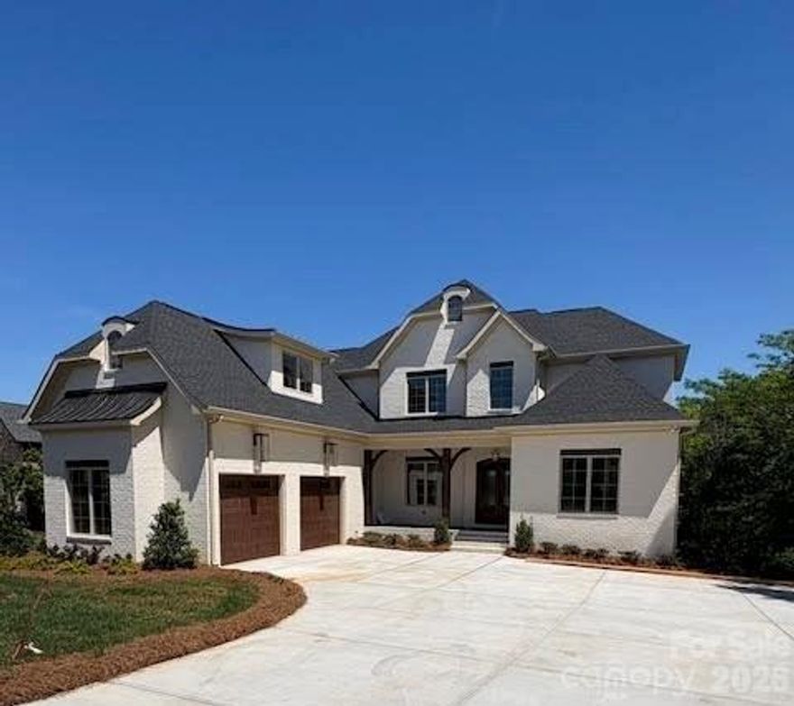 New construction in the prestigious gated Joslin Pointe community on Lake Wylie! This stunning 6-bedroom, 6-bath home offers a spacious open floor plan perfect for entertaining and everyday living. Enjoy lakefront living with your own covered dock and boat lift already in place—just steps from your backyard or enjoy the views from your covered porches. The gourmet kitchen features a large island, premium finishes, and high-end appliances, ideal for hosting and culinary creations. The finished basement offers another living space with  2nd owners suite, family room with wet a bar, island with beverage fridge, icemaker and a versatile space with an optional room ideal for a golf simulator, home theater or workout area. Thoughtfully designed with luxury and comfort in mind, this property provides breathtaking lake views, modern elegance, and private access to one of the area's most sought-after waterfront communities. Live the lake life in style! 
Pictures will be updated after landscaping is completed.