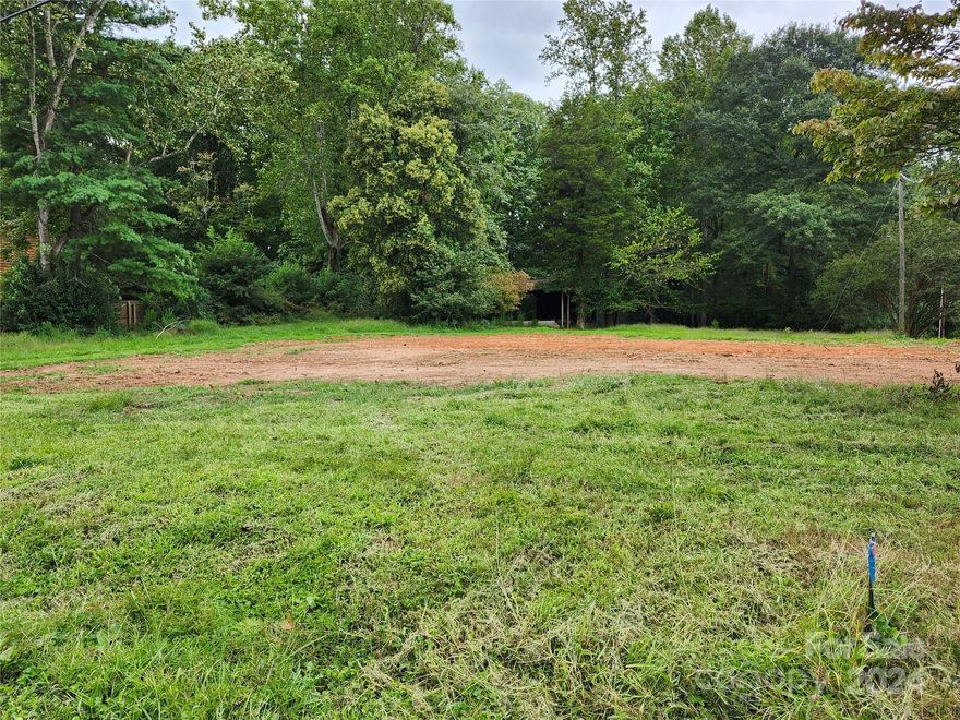 Location, Location, Location... Bring your builder, or a Builder can bring your buyers to this .689-acre lot with NO CITY TAXES, I repeat, NO CITY TAXES! There is no water/sewer bill either, this is a well and septic lot. Feel as if you're in a more rural setting with all the benefits of being close to Belmont, Lake Wylie, and Charlotte. The attached survey has not yet been recorded, it has been approved by the county, allowing purchasers to adjust lot sizes and driveway placement. This lot had a house previously, which has been torn down, the previous septic system has been removed and filled, perc test has been done for a new septic. The pole barn at the back of the lot could be utilized for multiple uses. At the moment, this is a combo of 2 partial lots 189879 & 189881. You can buy this single lot, 2 lots, or all 3 lots together.