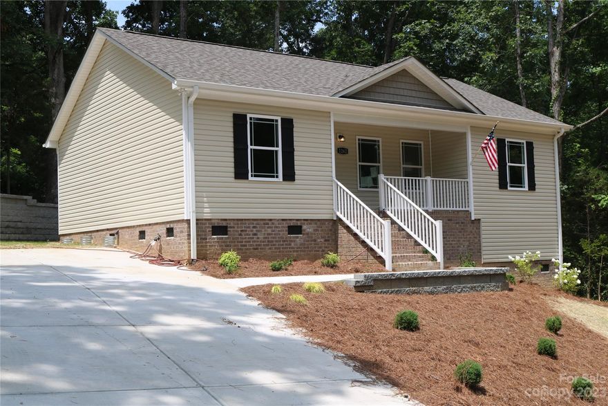 Welcome Home to this lovely, 3 bed 2 full baths, New Construction with beautiful finishes. There is plenty of natural light that flows throughout.  The layout is an open floor plan design with LVP floors throughout main living area/kitchen/baths. The Kitchen has granite counters, stainless steel appliances along with a sizeable pantry. The Kitchen area also opens to a 10x10 rear deck which is perfect for relaxing and entertaining.
This floor plan is a split bedroom option for primary bed/bath privacy from the other bedrooms and bath. The primary bedroom has a ceiling fan and a very large walk in closet. The primary bath also has a granite dual sink vanity. This is a thoughtfully designed home and an exceptional find you won’t want to miss.