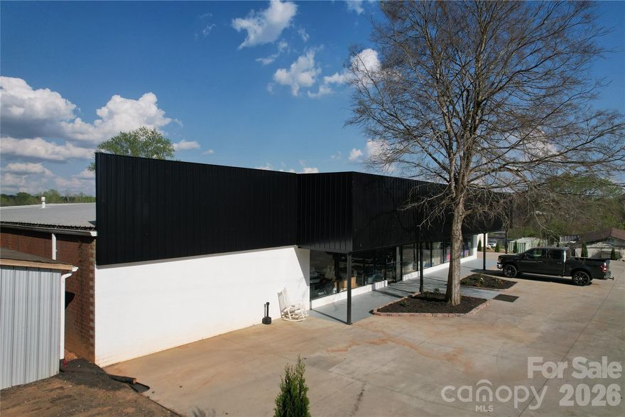 This 25,150± square foot commercial facility offers exceptional flexibility for a variety of business uses, with the added potential for multi-tenant income. The property features two loading docks, three roll-up doors, and a 150-foot covered front porch, providing efficient access for shipping, receiving, and daily operations.

Inside, the building includes two offices, two restrooms, and a dedicated break room, with ceiling heights ranging from 10 feet in the front section, 10–14 feet in the mid-section, and 12–16 feet in the rear—ideal for accommodating a range of industrial or commercial needs.

Recent improvements include updated landscaping and extensive new concrete surrounding the building, enhancing both functionality and curb appeal. An additional 14x93 exterior building with 8-foot ceilings is also located on the property (not included in the total square footage), offering further storage or operational space.

With the ability to lease the building in sections, this property presents a strong opportunity for investors or owner-users seeking income-producing potential in a well-equipped commercial setting.