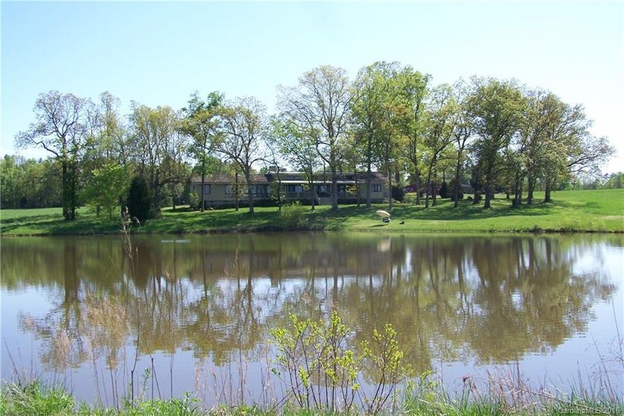 A spectacular rolling country property at the headwaters of Lake Monroe, a Union County reservoir.  The home is all highest quality construction and finishes.  There is detailed handmade tile work and custom cabinetry throughout the home along with many other special details.  The barn could easily be up-fitted for horses, though it is currently a workshop with great storage and an unfinished large upstairs. All the land is pastures and ready for horses or other animals.  Great lakeside living!