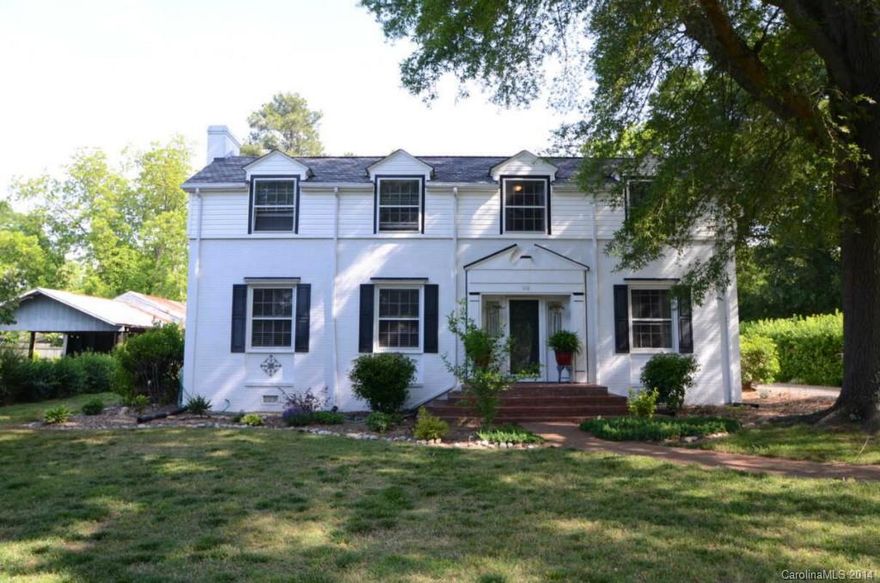 1 Block from downtown Clover w/ award winning schools. Beautiful 2 story colonial home w/ tons of character. Large living room w/wood burning FP, private den/home office w/gas FP. Master on main level w/ private bath. Eat In Kitchen offers working island, butlers pantry, working desk area & updated fixtures. Upper level freshly painted w/two large secondary bedrooms & full bath. Private .5 acre lot. Detached 2 car garage. 450 Sq Ft Wired workshop for all your tools. 1 YR home warranty included.