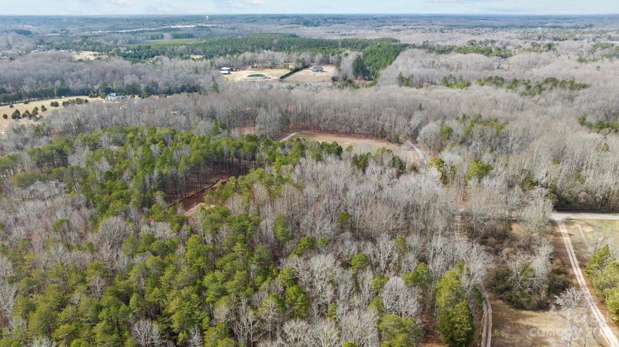 Beautiful, wooded 4 acre lot in a great location! This is an ideal spot to build your private retreat, or second home to get away from it all! With road frontage of over 220 feet and backing up to a meandering creek you will truly enjoy the privacy and beauty of this property. The property percs for a 5 BR home with multiple options for home sites to build your dream home. The hardwoods and pine trees offer a beautiful back drop while giving you the privacy that you are looking for. This property is surrounded by 5 other large estate lots all with the same building restrictions keeping a higher standard for the surrounding home sites. Minimum sq footage for a one story dwelling is 1250 heated sq ft, and a two story dwelling has a minimum of 1,800 heated sq ft. With being only 6 minutes from charming downtown York and just over 10 minutes from Clover this location offers great convenience while still feeling secluded! Don't miss your opportunity to build your dream home!