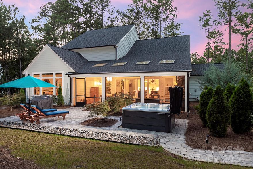 Enjoy luxury and privacy in the prestigious gated community of Riverchase Estates. This well-appointed, custom home exudes elegance and sophistication. The main level offers two bedrooms with full en suite bathrooms and an open floor plan perfect for relaxing and entertaining. Enjoy the view at dinner or in the living room through your panoramic sliding doors, or in your custom screened patio- looking out at nature while basking in ample natural light. This home features over $110k in upgrades after the build was completed; it’s Energy Star certified, transferable termite warranty, new custom closet system and quartz countertop;  expanded back patio and walking paths; upgraded Sundance hot tub, generator and more for your comfort and enjoyment. Inquire for full list of upgrades and features. Complimented by the amenity-rich neighborhood situated by the Catawba River- and easily accessible to main roads and cities- this home is ready for you to call it Home.