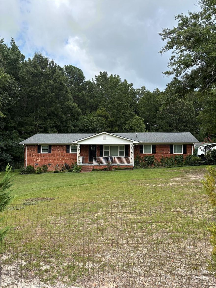 Available November 1st, this adorable brick ranch in Lancaster, SC offers the perfect blend of charm, comfort, and privacy. Nestled on a peaceful 2-acre lot, this home is surrounded by nature, giving you space to relax and unwind. Inside, the open concept living space is warm and welcoming, perfect for both everyday living and entertaining. The kitchen comes fully equipped, with all appliances included, making move-in a breeze. A detached 2-car garage provides plenty of room for parking, storage, or hobbies. Whether you’re enjoying a quiet evening on the porch or taking in the beauty of your private yard, this home feels like a true retreat. Don’t miss the chance to make it yours!