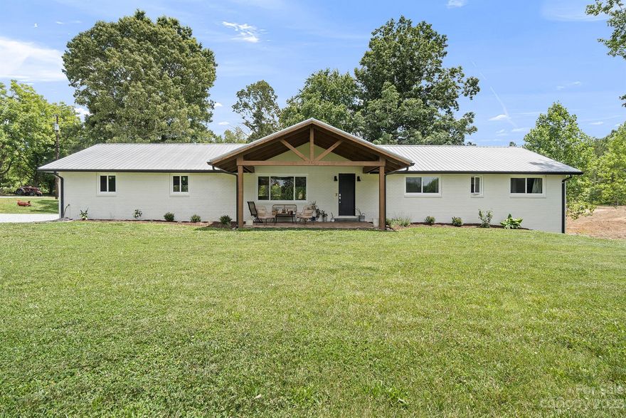 If your next house needs that "new home feel" along with acreage and privacy, but you want to be close to life's essentials, this property checks your boxes.  The current owners have made several improvements to the 10.5+ acres of land, and have basically remodeled the entire home.  The complete list of improvements over the last three years could fill a book, but they include new roofing, flooring, appliances, plumbing, wiring, hvac system, water heater, doors, windows, etc., etc.  The land is a canvas for you to create a new pasture for the animals, a garden, or that home workshop you have always wanted.   There are already 6 different outbuildings that will convey with the property, including chicken coops and a playhouse.  The gravel driveway goes through the entire property connecting two different roads at two different entrances.  A great combo of a newly remodeled home and unrestricted, private acreage that is just waiting for you to put your own personal touches in place.