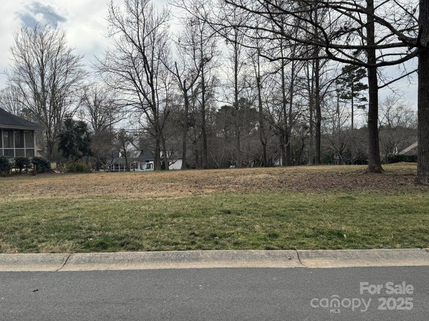 Beautiful homesite in the Millingport neighborhood of Old North State Club's gated community! Build your dream home and enjoy exceptional views & the convenience of the putting green in the back. The lot is an easy walk to Old North State Club amenities. Become a member of the Club for access to its recently renovated championship golf course, dining, pools, tennis/pickleball courts & more.