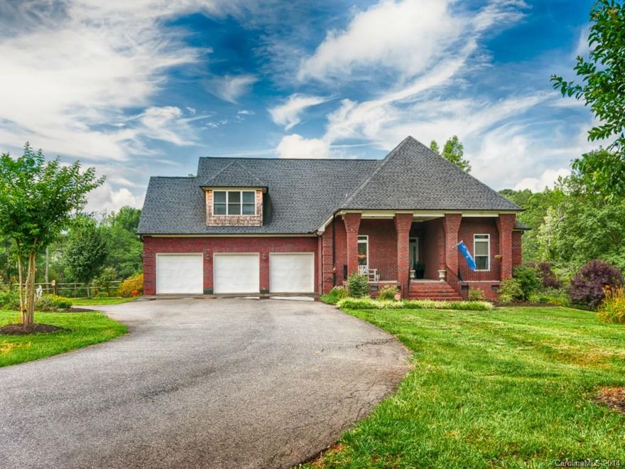 4 1/2 acres with a Pond! All Brick Custom-Built home with Brazilian Cherry Floors, Quartz Countertops, High Ceilings, Stone Fireplace, Split-Rail fence, Screened Porch, Patio and oversized open Deck attached to screened in porch off master bedroom!! Double hung vinyl windows. Bonus Room and Full Bath above  3 car Garage...lots of storage...Come Home to Flying Eagle Estates!