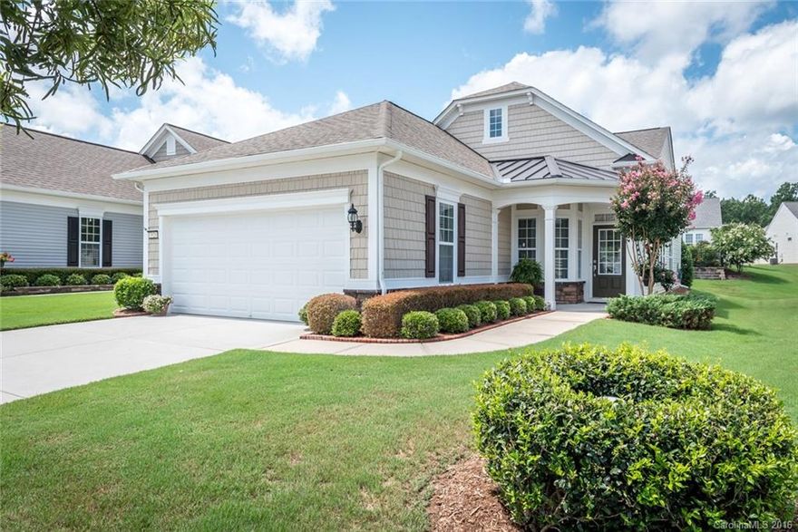 Beautiful Pine Spring with sunroom. Great landscaping including extended flower beds and a retractable awning on the rear patio plus a privacy fence. It features hardwoods in the entry foyer and office and an open layout between the great room and dining room. A large eat-in kitchen at the rear of the home is a great spot for entertaining.  Enjoy easy living in this delightful home in the active adult 55+ Sun City Carolina Lakes community.