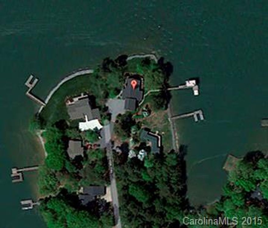AMAZING WATERFRONT PROPERY w/gorgeous big-lake views on 3 sides! One of the best lots on Lake Norman. Decks all around home to enjoy views! Private pier & boat dock w/lift, 2 jet-ski ramps & lg upper sunning deck. 2-story GR w/stone fireplace & 150 yr old historic mantel. Updated kitchen w/SS appls. 4 spacious BRs, 4 full baths. Office. 2-car garage. Blueberry bushes galore! Privately located on culdesac. Tons of storage & parking. Great for entertaining! Quiet neighborhd. 30 mins to Charlotte.
