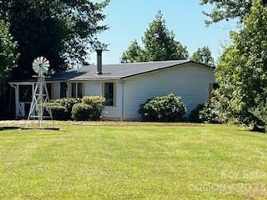 Price Reduction! Charming 3br/2ba home on almost 2 private acres of serene privacy and mountain views. Super home and excellent location. No restrictions. Less than 10 Mins. from Tryon International Equestrian Center (TIEC) and local wineries!! Income producing airbnb or long term rental approx. 20K/year .  Comes furnished and has a proven rental history.  Nice large yard, fenced in area in the back. Mostly cleared. Spend time on screened in deck relaxing with peaceful views, large open deck area too. Nice 10 x 16 shed with work bench. covered front porch. The living room has a  wood burning fireplace to cozy up to in the winter! This home has been loved and well cared for, has some updates. The furnace has been repaired and upfitted recently and AC has been replaced! Newer roof as well. There is plenty of parking with the 2 car carport and additional spots.  Easy access to Tryon, Hendersonville, Rutherfordton/Forest City, Landrum, and Asheville!!