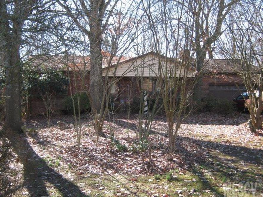 Full brick home surrounded by mature landscaping. Backyard partially fenced. Large living room with fireplace. Full unfinished basement. Convenient location. No city taxes. Selling "As is". Cash only.