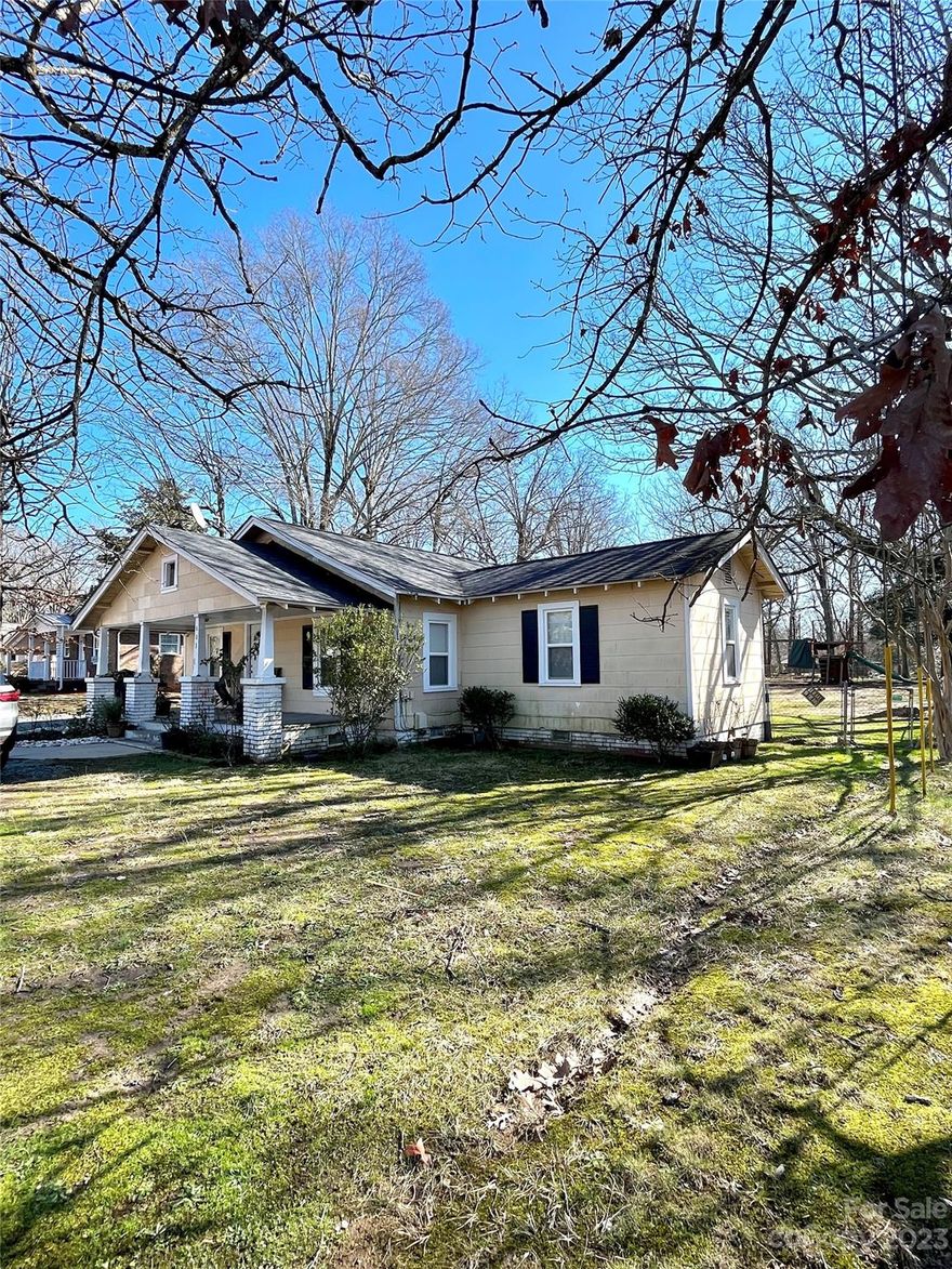 Adorable Three Bedroom Home on Lovely Patton Avenue in Monroe! Convenient! Fenced rear yard, detached garage/bldg, windows updated in recent years & more! Cozy front porch graced with characteristic columns. Circle driveway, huge backyard.