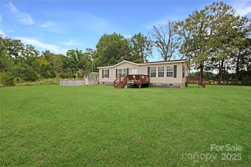 Charming 3-bedroom, 2-bath home situated on a spacious .9-acre lot offering plenty of room to relax and enjoy the outdoors. This property provides the perfect blend of comfort and space, with endless possibilities for gardening or entertaining.
