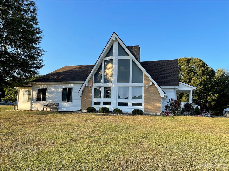 Use 1040 Odell School Road for GPS navigation and mail delivery!
Enjoy being tucked away on your own two acres.  Great Room with post and beam tongue and groove cathedral ceiling with Massive brick fireplace.  Your view of neighboring pasture and barn will make you feel like you are on 10 acres!  Unique find with an awesome location just minutes from Concord Mills Mall. Full basement makes a great workshop complete with a one car garage area that can be expanded back to the original two car garage.