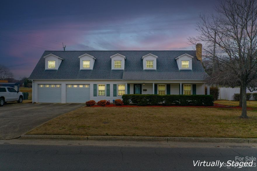 Welcome to your new home! This cozy Cape Cod-style house is a half mile to historic downtown Clover. Inside, you'll find a spacious great room with a brick  fireplace and a formal dining room. The kitchen has been completely remodeled with white soft close cabintry and granite countertops! Enjoy low maintenace with gorgeous laminate flooring on the main floor. Convenient full bedroom and bath suite on the main floor is perfect for guests! The primary bedroom is spacious with an attached loft area or office.  Enjoy the covered front and rear porches, along with a fenced backyard and detached storage building. With an attached 2-car garage your vehicles will be well taken care of. Situated in the Clover School District, this home is conveniently located just minutes away from grocery stores, shopping, and schools!