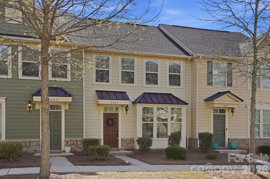 Desirable townhome in City Park. This light-filled home features an open-concept main level connecting the living, dining, and kitchen areas—perfect for both everyday living and entertaining. The spacious living room offers great natural light, creating a warm and inviting atmosphere. The dining area flows effortlessly into the kitchen, creating an ideal hosting environment. The kitchen is designed to impress, featuring an eat-in island, additional bar seating at the sink, granite countertops, and stainless steel appliances. A convenient powder room completes the main level. Upstairs, you’ll find two secondary bedrooms sharing a well-appointed hall bath, along with a laundry room conveniently located on the bedroom level. The primary suite offers generous space, a walk-in closet, and a beautifully finished en suite with a double vanity, and a linen closet for added storage. Outdoor living extends to an expanded patio leading to an oversized one-car garage. Close proximity to community amenities elevate the lifestyle with a pavilion featuring built-in grills, corn hole, a fire pit, and picnic areas. Ideally located just minutes from South End, Uptown, and CLT Airport, with dining, shopping, and major routes nearby. On weekends, enjoy the convenience of being walking distance to the Charlotte Regional Farmers Market, Starbucks, or Chipotle. Plus, take advantage of direct access to 135-acre Renaissance Park, offering ball fields, sand volleyball, a skate park, dog park, and disc golf. An incredible opportunity to own in one of Charlotte’s most connected and convenient communities for only $375k.