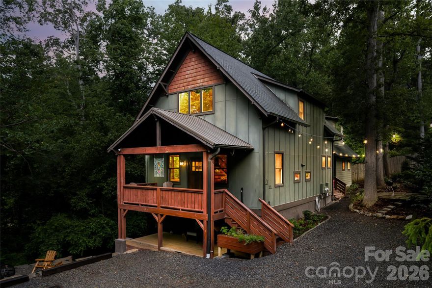 This rare DUPLEX-style home, less than a mile from downtown, is privately set on a tucked-away flag lot in Asheville’s historic Montford district, offering a unique blend of seclusion, security, and modern flexibility. This property offers five designated parking spaces plus additional street parking, creating a rare and highly functional setup for a live/work lifestyle. With a separately metered apartment, it’s ideal for business use, client access, or potential tax advantages. Built just 12 years ago, it provides the peace of mind of newer construction, an appealing alternative to many neighboring homes approaching a century in age. The main residence (1,608 SF) features an open-concept layout, a vaulted front porch, and a chef’s kitchen with island and breakfast bar. The main-level suite includes a tiled walk-in shower, while the upper level offers two spacious bedrooms with soaring ceilings, oversized closets, and a shared full bath with double vanity. The attached APARTMENT (647 SF), with its own private entrance, functions as a true second residence, making this Duplex configuration ideal for rental income, guest accommodations, multigenerational living, or a dedicated home office. This built-in income opportunity provides a compelling way to offset ownership costs. The flag lot setting enhances the property with reduced street traffic, added privacy, and a quiet, retreat-like atmosphere, while still maintaining convenient access to downtown amenities. Outdoor living is equally inviting, with multiple private sitting areas, garden pathways, and close proximity to nearby parks and neighborhood trails. Additional highlights include LP Smart siding, energy-efficient systems, and a standing-height sealed crawlspace. A rare opportunity to own a modern home with income-producing potential and a private setting just moments from downtown Asheville.