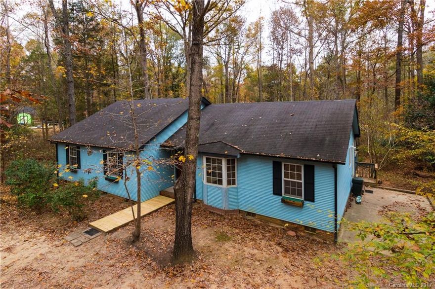 Don't miss this opportunity to own in Black Horse Run!  Great potential in this 3 bedroom 2 bath ranch situated on a 2 acre wooded lot conveniently located minutes from Ballantyne.  Walking and riding trails, club house and pool.  Can close quickly.  Call to schedule an appointment today.  2-10 Warranty provided.