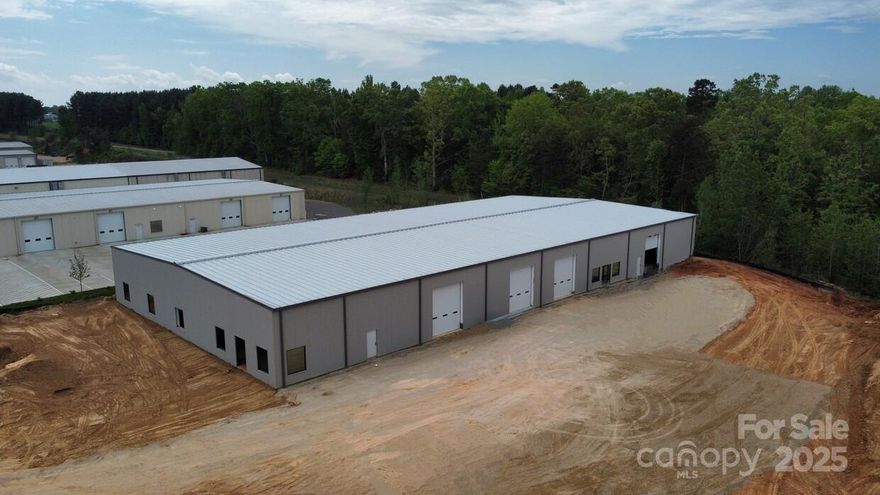 Currently under construction.  Located in highly desirable South Fork Business Park on cul-de-sac lot. Located off Mazeppa Road in Mooresville, NC. Conveniently located in the heart of racing country only 6 miles from I-77. Other businesses in the park include manufacturing, distribution, motorsports. Standard upfit includes 2 offices, 2 bathrooms, and 2 rollup doors. Includes HVAC and sprinklers throughout, glass allowance, electrical allowance, plumbing allowance, and landscaping allowance.  Perfect for race shop, warehouse, distribution, manufacturing, or many other uses.  Additional offices, bathrooms and any other full custom interior upfit available for additional charge.

**Front of building has recently been updated**