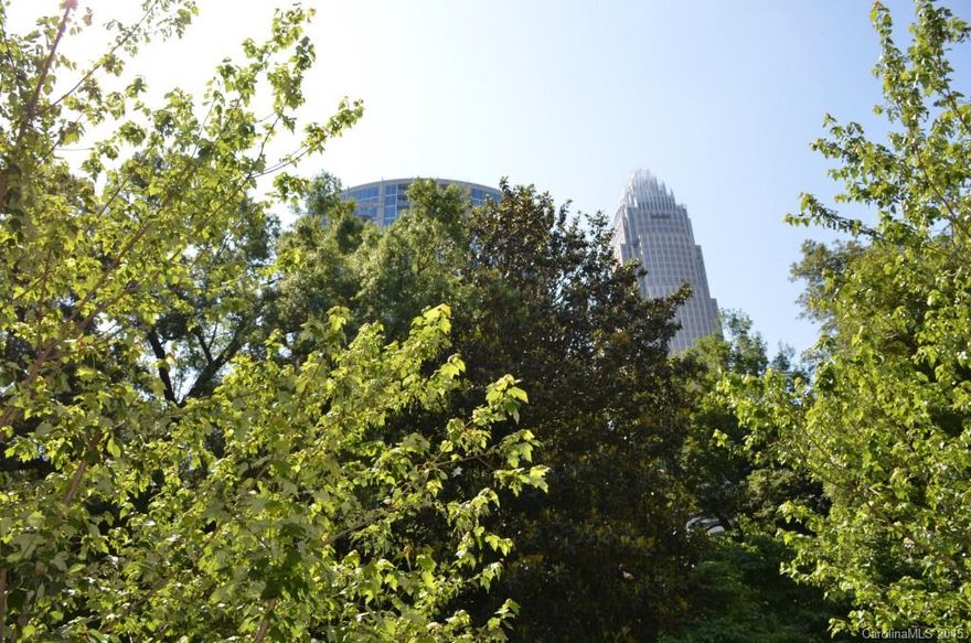 Beautiful Condo @ The Highly Sought After Fifth & Poplar. Lg Private Patio Overlooking The Park and Skyline View! Open Flr Plan w Gorgeous New Wood Flrs--Kitchen w Updated Fixtures, Stainless Backsplash, SS Appls, Granite.Upgraded Bathrooms w Granite and Tile. Spacious Bedrooms & Walk In Closets. Amenity Rich Community w/ 24 hr Concierge, Pool, Fitness, Putting Green, Dog Park, Media Room, Cyber Café. Great Fourth Ward Location w Harris Teeter in the building!! Walk to all Uptown has to Offer!