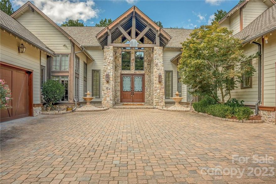 This one of a kind, former Homarama home, will not disappoint.  Get the feeling of being in a mountain chalet in Aspen with amazing wood floors, soaring ceilings, exposed beams, fantastic trim work, stone archways, multiple fireplaces, wine cellar and tons of space.  This executive home backs up to the 1st fairway of The Palisades Golf course and has tons of privacy.  Enjoy sipping coffee on the screened in porch on the main level, or the covered patio on the lower level, or even the back patio with hot tub.  This home boasts a full kitchen and bar on the lower level, elevator, theater, two laundry rooms, 4 HVAC units, two water heaters, two mechanical rooms with extra storage.  This home has it all.