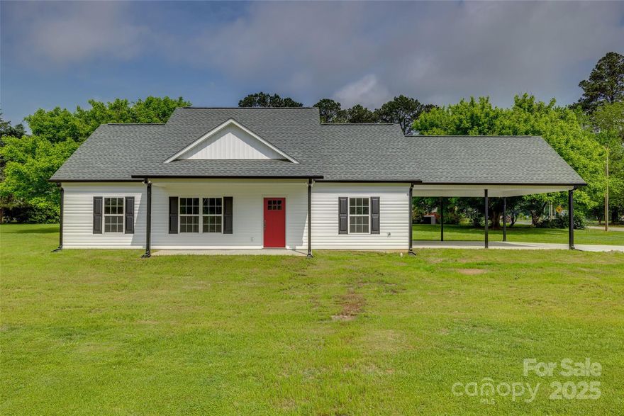 Brand new home in the Elgin Community of Lancaster SC! This beautiful 3-bedroom, 2-bath home sits on spacious lot, offering plenty of outdoor space for play, gardening, or entertaining. Inside, you'll love the open layout and stylish finishes, including LVP flooring throughout all common areas—durable, low-maintenance, and perfect for modern living. The kitchen and living spaces are designed for comfort and functionality, making this home ideal for both daily life and gatherings. Step outside to a covered 2-car carport and enjoy the benefits of an oversized concrete driveway—great for extra parking or a clean space for outdoor activities. This move-in-ready home combines quality craftsmanship with thoughtful design, all in a convenient location with easy access to nearby towns and highways. Don’t miss your chance to own a brand new home with space to spread out! *Photos are from the same style home being built, but please note—the floor plan and carport will be flipped in this version*
