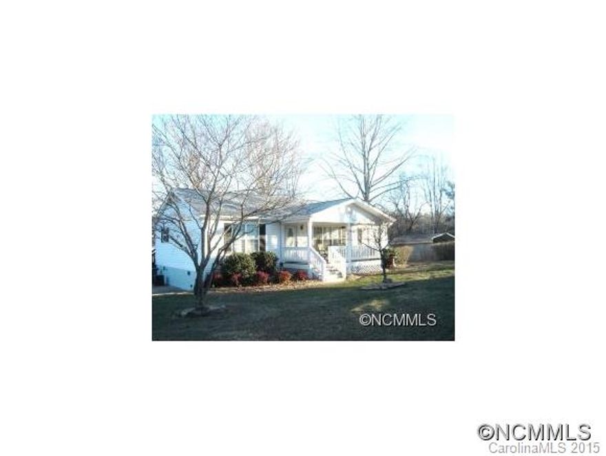 Immaculate off frame modular in quaint Mills River with upgrades.  Hardwood floors throughout, split bdrms, Large master bdrm with large bath and oversized tiled shower. Covered front porch and back deck, 2 car carport, storage bldg. Wonderful level lot with beautiful landscaping.  Partial fenced.