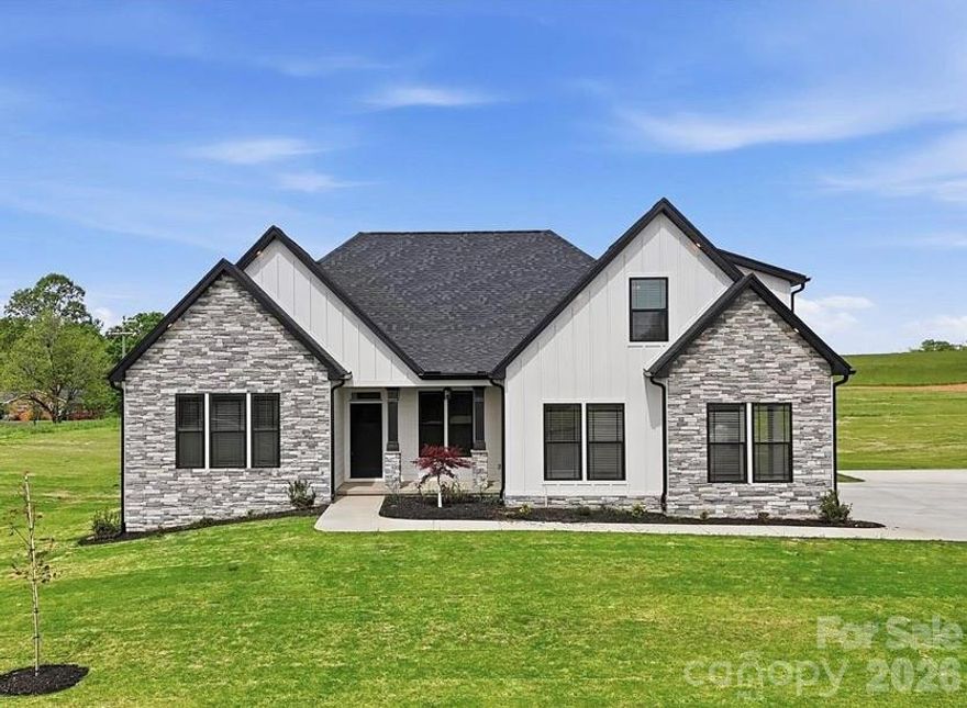 Custom home by local builder on 1.5 acres in Columbus/Greene Creek area! Enchanted Homes' Elite Series. Countless upgrades included. Wall ovens, Upgraded Flooring, Tile Shower w/Frameless Glass Door, Stone Work. Finished Room Above Garage with Bump Out Dormer for extra space. Beautiful views through Living Room, Master and back patio. Extensive trim work and site built columns. Scheduled to be complete around September 2025. The Beaumont Elite with site specific customizations. Must See!