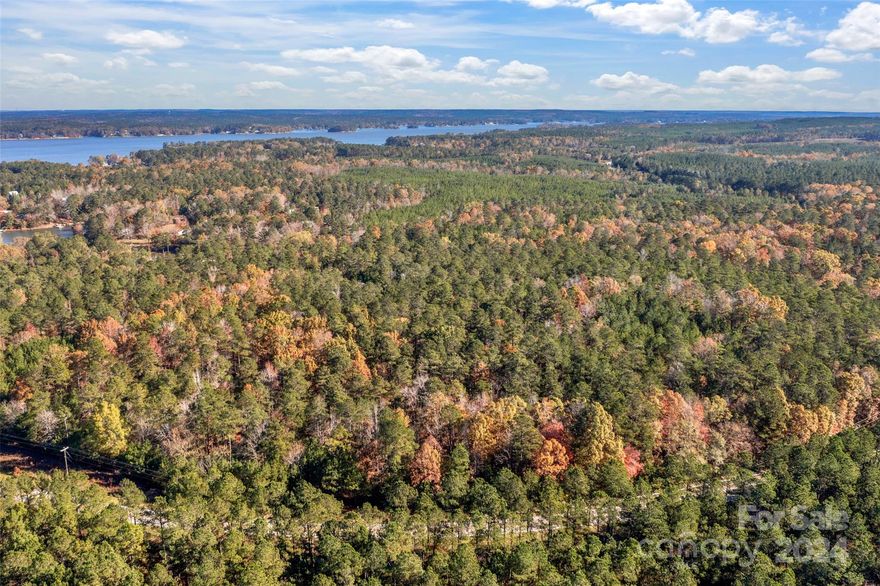 Spacious +/- 6 Acres in the highly desired Lake Wateree area! With a Ridgeway address, you will be minutes away from Colonel Creek Landing (Lake Wateree access), gas stations, Lake Wateree Park, and other modern amenities! Easy access to HWY -21, I-77. Private wooded lot for your custom dream home. If you are looking for a peaceful homesite, this is the land for you! About 800' of road frontage which creates easy access. There are electrical utilities available at the street.  With the large lot size, pursue building your dream home, use this land for your small farm and other gardening activities.